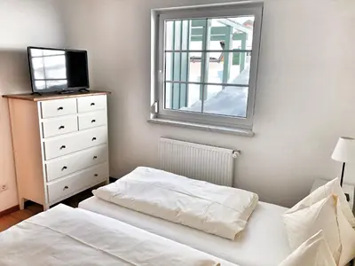 Ein Bett oder Betten in einem Zimmer der Unterkunft Hubertus Dependance