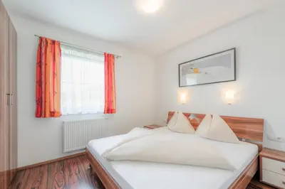 Ein Bett oder Betten in einem Zimmer der Unterkunft Alpenjuwel Appartements