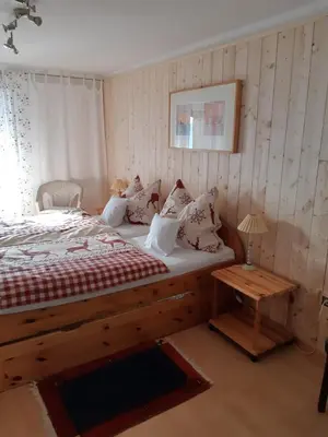 Ein Bett oder Betten in einem Zimmer der Unterkunft Haus Mauken - Appartments mit Panoramablick