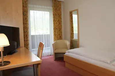 Ein Bett oder Betten in einem Zimmer der Unterkunft Hotel Post