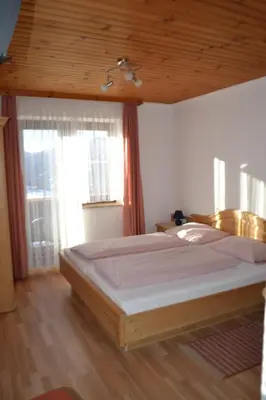 Ein Bett oder Betten in einem Zimmer der Unterkunft Innviertler Berggasthof