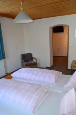 Ein Bett oder Betten in einem Zimmer der Unterkunft Innviertler Berggasthof