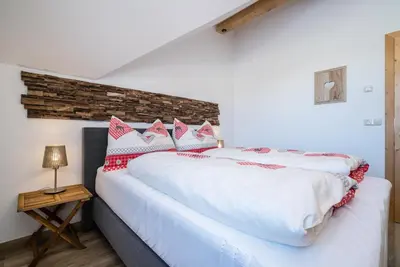 Ein Bett oder Betten in einem Zimmer der Unterkunft Pistenblick