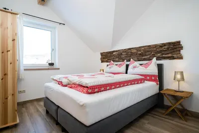 Ein Bett oder Betten in einem Zimmer der Unterkunft Pistenblick