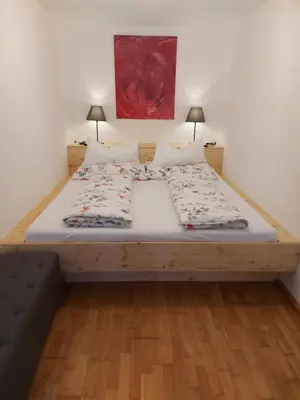 Ein Bett oder Betten in einem Zimmer der Unterkunft Ferienwohnung Woferlbauer