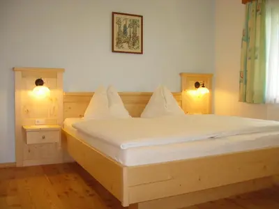 Ein Bett oder Betten in einem Zimmer der Unterkunft Biobauernhof Nussbaumer