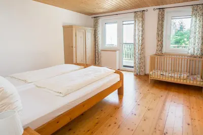 Ein Bett oder Betten in einem Zimmer der Unterkunft Familienferienhof Stabauer