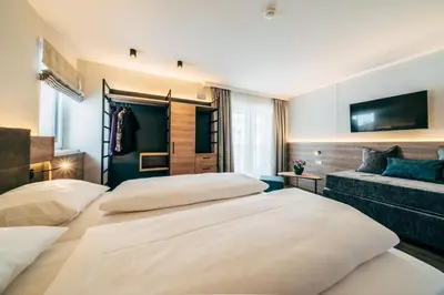Ein Bett oder Betten in einem Zimmer der Unterkunft FOXY Obertauern