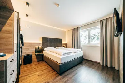 Ein Bett oder Betten in einem Zimmer der Unterkunft FOXY Obertauern