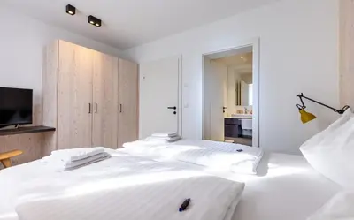 Ein Bett oder Betten in einem Zimmer der Unterkunft wohn.genuss app traumhaus