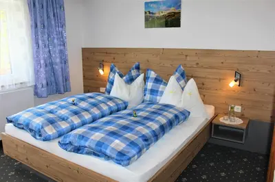 Ein Bett oder Betten in einem Zimmer der Unterkunft Gästehaus Oberauer