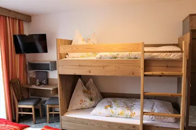 Ein Bett oder Betten in einem Zimmer der Unterkunft Gästehaus Oberauer