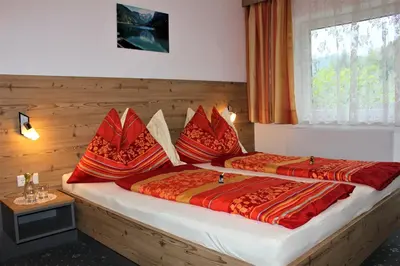 Ein Bett oder Betten in einem Zimmer der Unterkunft Gästehaus Oberauer