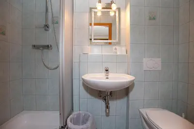 Ein Badezimmer in der Unterkunft Gasthof - Pension Ödsteinblick