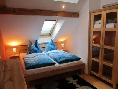 Ein Bett oder Betten in einem Zimmer der Unterkunft Ferienhaus Waldsicht