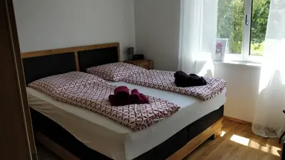 Ein Bett oder Betten in einem Zimmer der Unterkunft Alpenblick