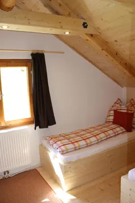 Ein Bett oder Betten in einem Zimmer der Unterkunft Blockhütte Radmer