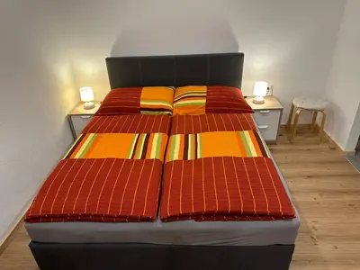 Ein Bett oder Betten in einem Zimmer der Unterkunft Ferienwohnung Wohlfahrter