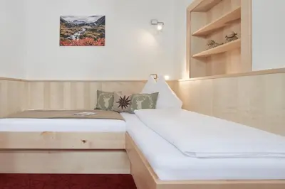 Ein Bett oder Betten in einem Zimmer der Unterkunft Gästehaus Herma