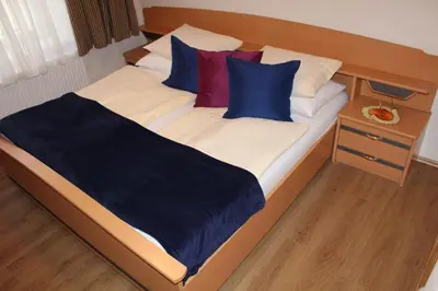 Ein Bett oder Betten in einem Zimmer der Unterkunft FEWO Gabi Haus Pacher