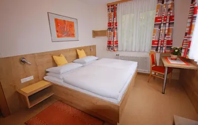 Ein Bett oder Betten in einem Zimmer der Unterkunft Pension Vocario