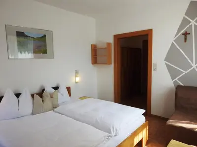Ein Bett oder Betten in einem Zimmer der Unterkunft Pension Vocario