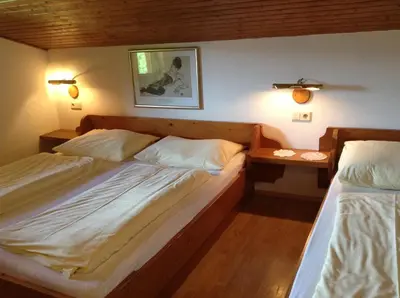 Ein Bett oder Betten in einem Zimmer der Unterkunft Ferienhaus Bergland
