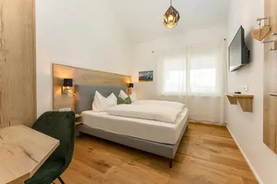 Ein Bett oder Betten in einem Zimmer der Unterkunft The Nest in Aich by Schladming-Appartements