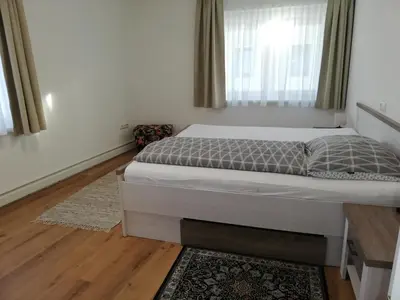 Ein Bett oder Betten in einem Zimmer der Unterkunft Ferienwohnung Schmied 3