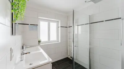 Ein Badezimmer in der Unterkunft Moderne Ferienwohnung mit Bergblick