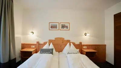 Ein Bett oder Betten in einem Zimmer der Unterkunft Ranstl Ferienwohnungen