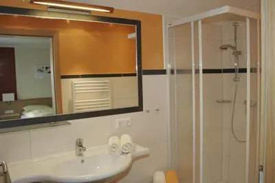 Ein Badezimmer in der Unterkunft Edelweiss Apartments