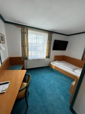 Ein Bett oder Betten in einem Zimmer der Unterkunft 1A Landhotel Schicklberg