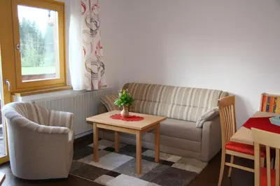 Ein Sitzbereich in der Unterkunft Haus Harmonika