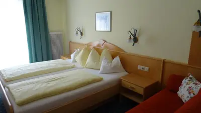 Ein Bett oder Betten in einem Zimmer der Unterkunft Hotel Sportpension Reiter