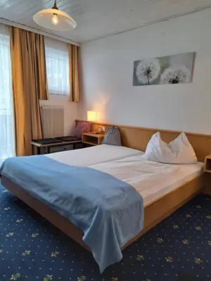 Ein Bett oder Betten in einem Zimmer der Unterkunft Sonnenhügel