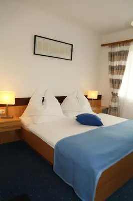 Ein Bett oder Betten in einem Zimmer der Unterkunft Sonnenhügel