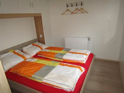 Ein Bett oder Betten in einem Zimmer der Unterkunft Mobilheim Adler Horst
