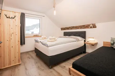 Ein Bett oder Betten in einem Zimmer der Unterkunft Pistenblick Alpin
