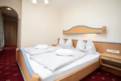 Ein Bett oder Betten in einem Zimmer der Unterkunft Rosspointnerhof