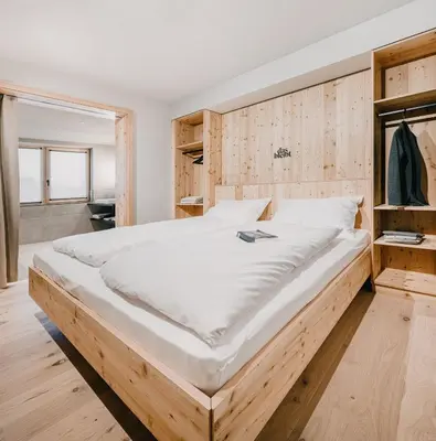 Ein Bett oder Betten in einem Zimmer der Unterkunft das bleibt Alpine Suites