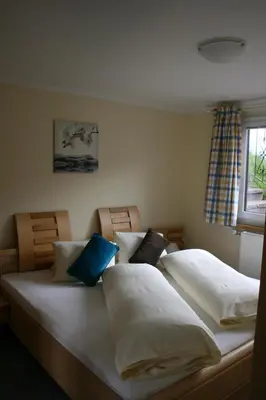 Ein Bett oder Betten in einem Zimmer der Unterkunft Haus Bergliebe