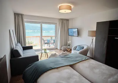 Ein Bett oder Betten in einem Zimmer der Unterkunft SEE Moment Appartements ADULTS ONLY