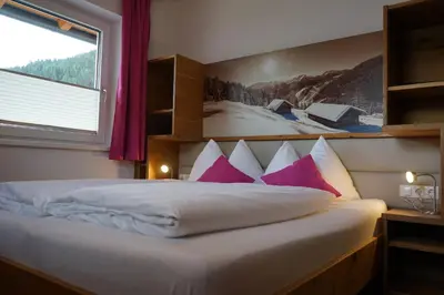 Ein Bett oder Betten in einem Zimmer der Unterkunft Bergfink apartments