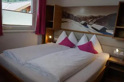 Ein Bett oder Betten in einem Zimmer der Unterkunft Bergfink apartments
