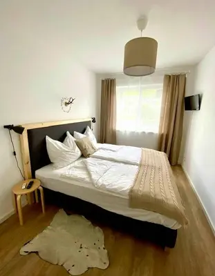 Ein Bett oder Betten in einem Zimmer der Unterkunft App. Seyrl im Haus Karoline