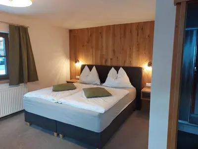 Ein Bett oder Betten in einem Zimmer der Unterkunft Haus Hinterfürbach