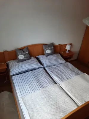 Ein Bett oder Betten in einem Zimmer der Unterkunft Ferienwohnung Evi