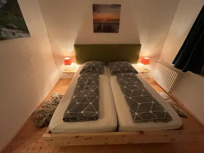 Ein Bett oder Betten in einem Zimmer der Unterkunft Ferienwohnung Mariana