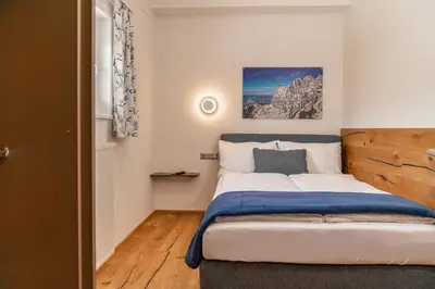 Ein Bett oder Betten in einem Zimmer der Unterkunft Apartments Greisslerei